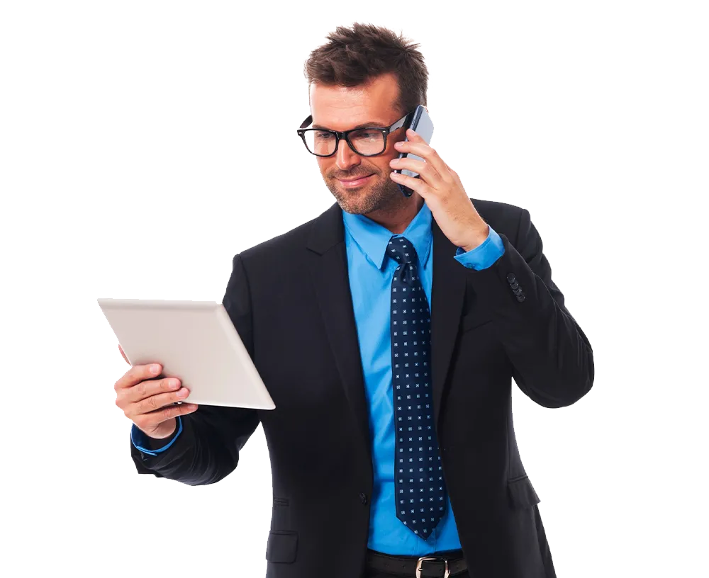 Confident forex trader in a suit holding a tablet and talking on the phone
