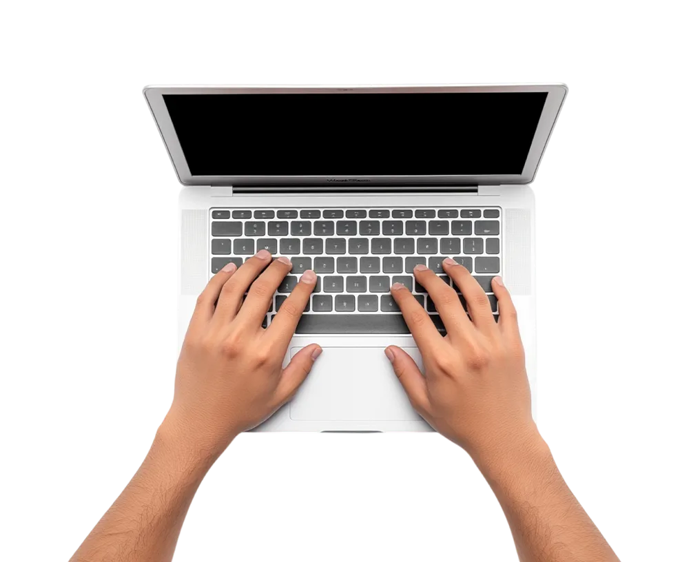 Top view of hands typing on a laptop keyboard with the screen turned off.