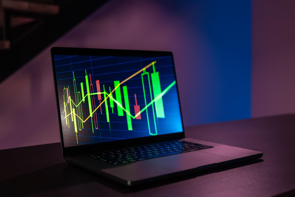 Laptop displaying forex trading charts and candlestick patterns, illustrating market analysis for those looking to start investing in forex.